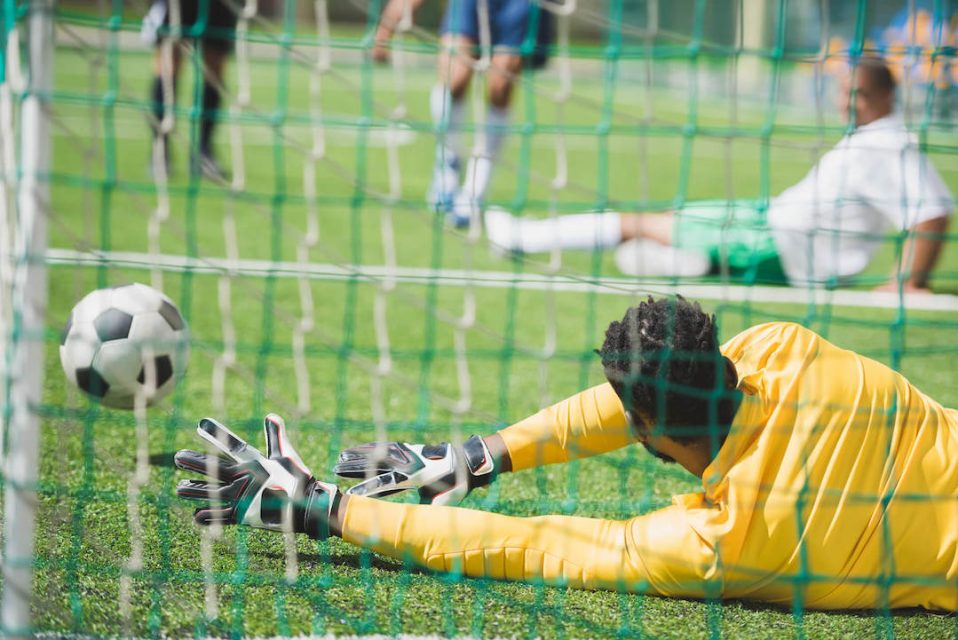 back-view-of-goalkeeper-catching-ball-during-socce-2021-08-29-11-18-39-utc-1.jpg